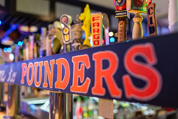 pounders sign with beer tap handles